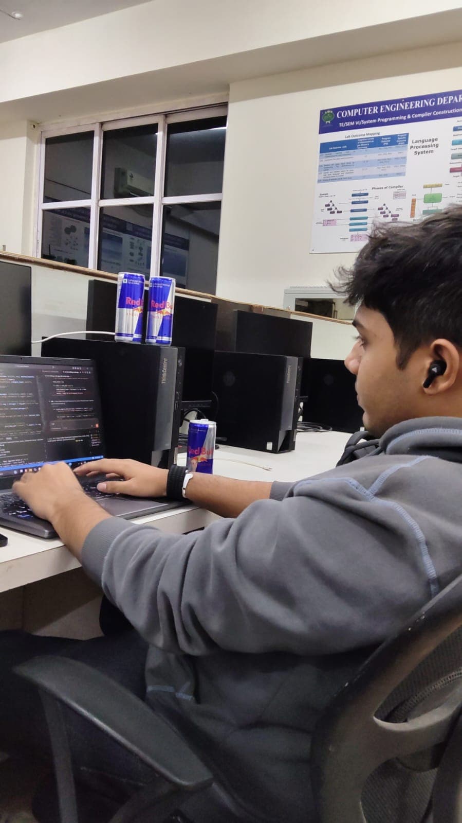 Laptop and an energy drink during a hackathon